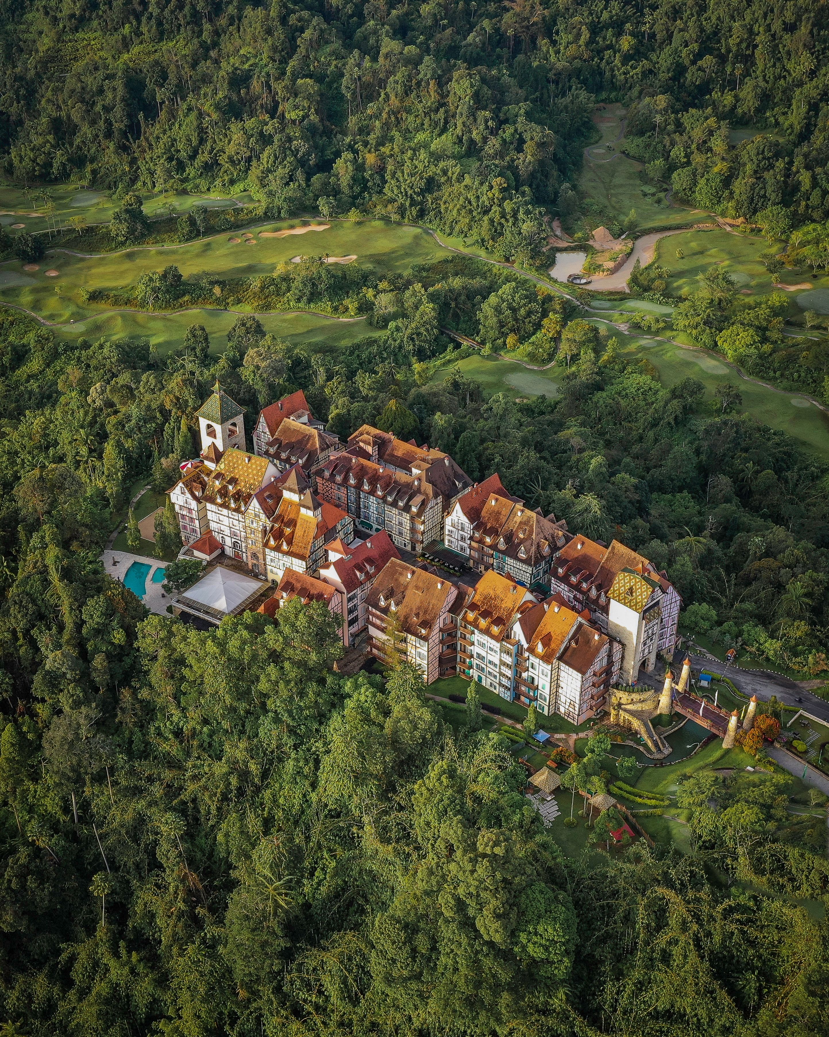 A stunning aerial view of Colmar Tropicale surrounded by lush greenery in Bentong, Malaysia.