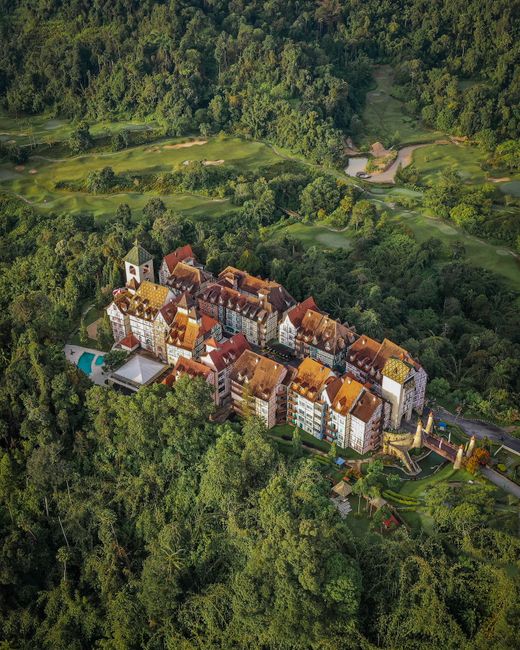 A stunning aerial view of Colmar Tropicale surrounded by lush greenery in Bentong, Malaysia.
