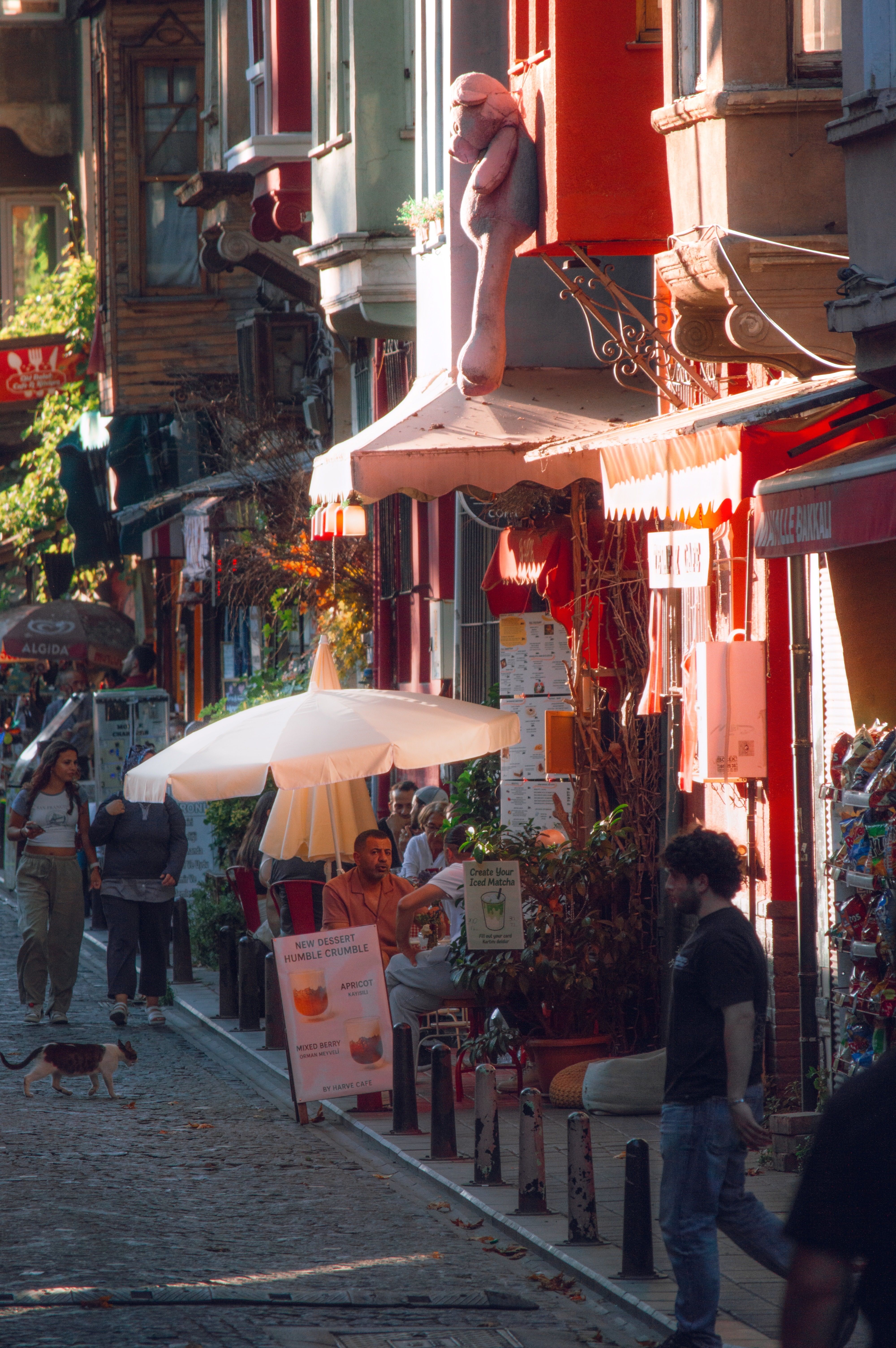Colorful European Street Scene with Cafes · Free Stock Photo