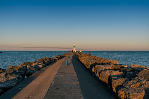Free A tranquil scene at Holland Michigan pier with early morning light and calm waters. Stock Photo
