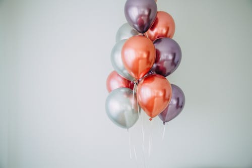 Free Woman Holding White and Red Balloons Stock Photo