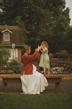 A mother and child enjoy a playful moment outdoors, capturing a warm family connection in Brevard, North Carolina.