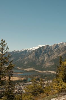 Breathtaking view of snow-capped mountains and lakes in Banff National Park during spring.