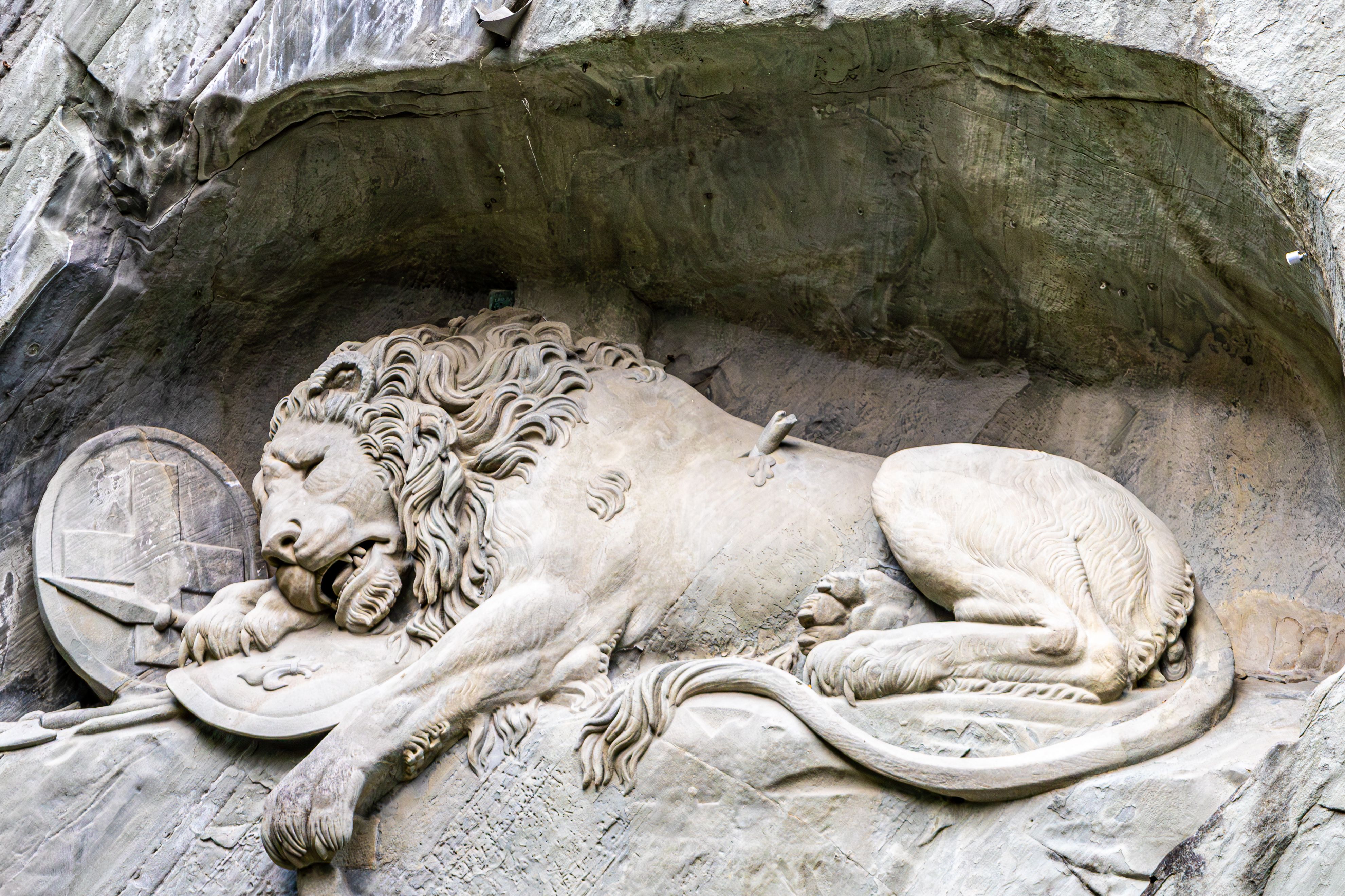 lucerne switzerland lion monument dying lion sandstone carved rock mark twain mournful