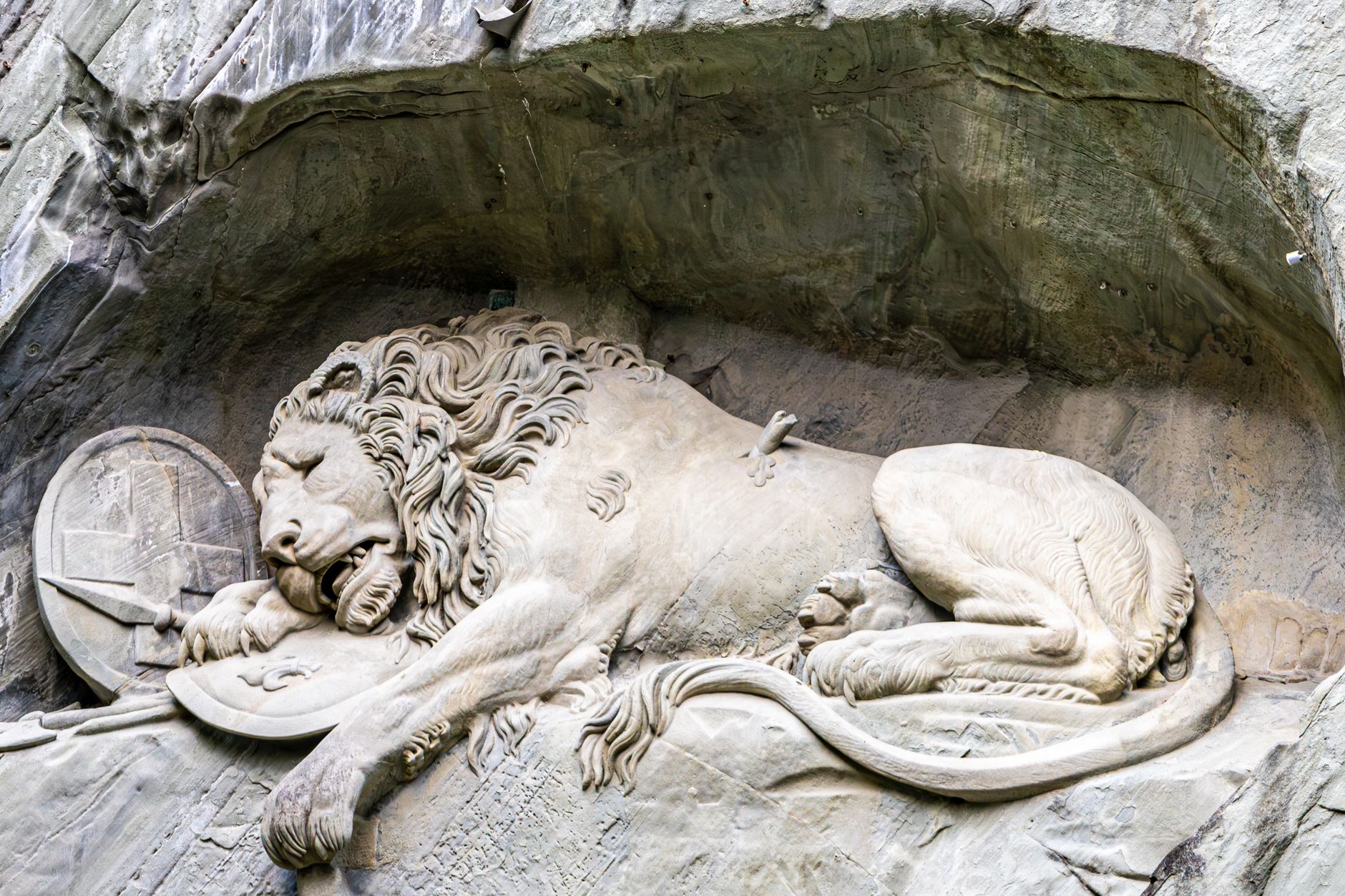 lucerne switzerland lion monument dying lion sandstone carved rock mark twain mournful