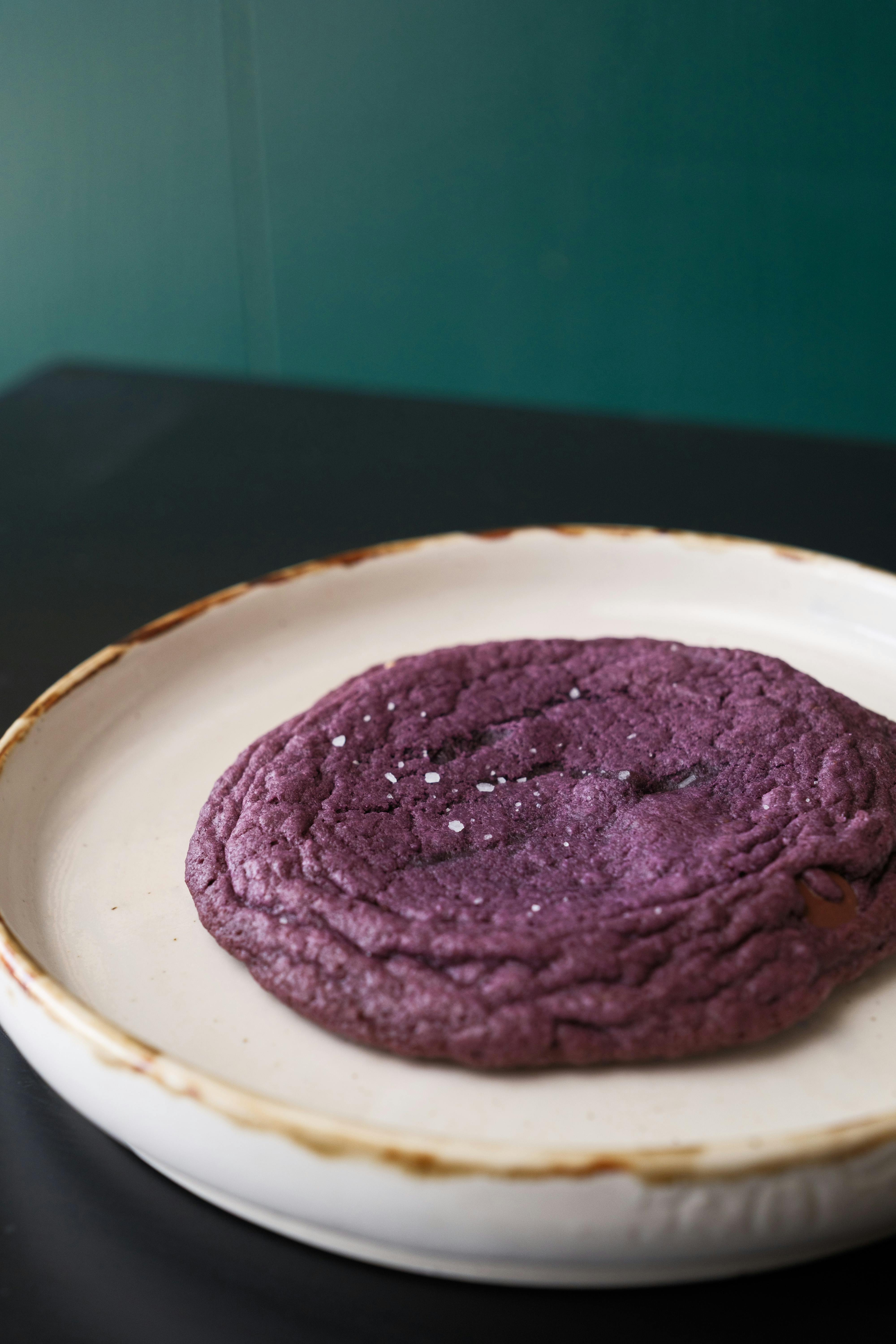 Savory ube cookie served on a rustic plate, showcasing Filipino dessert culture.