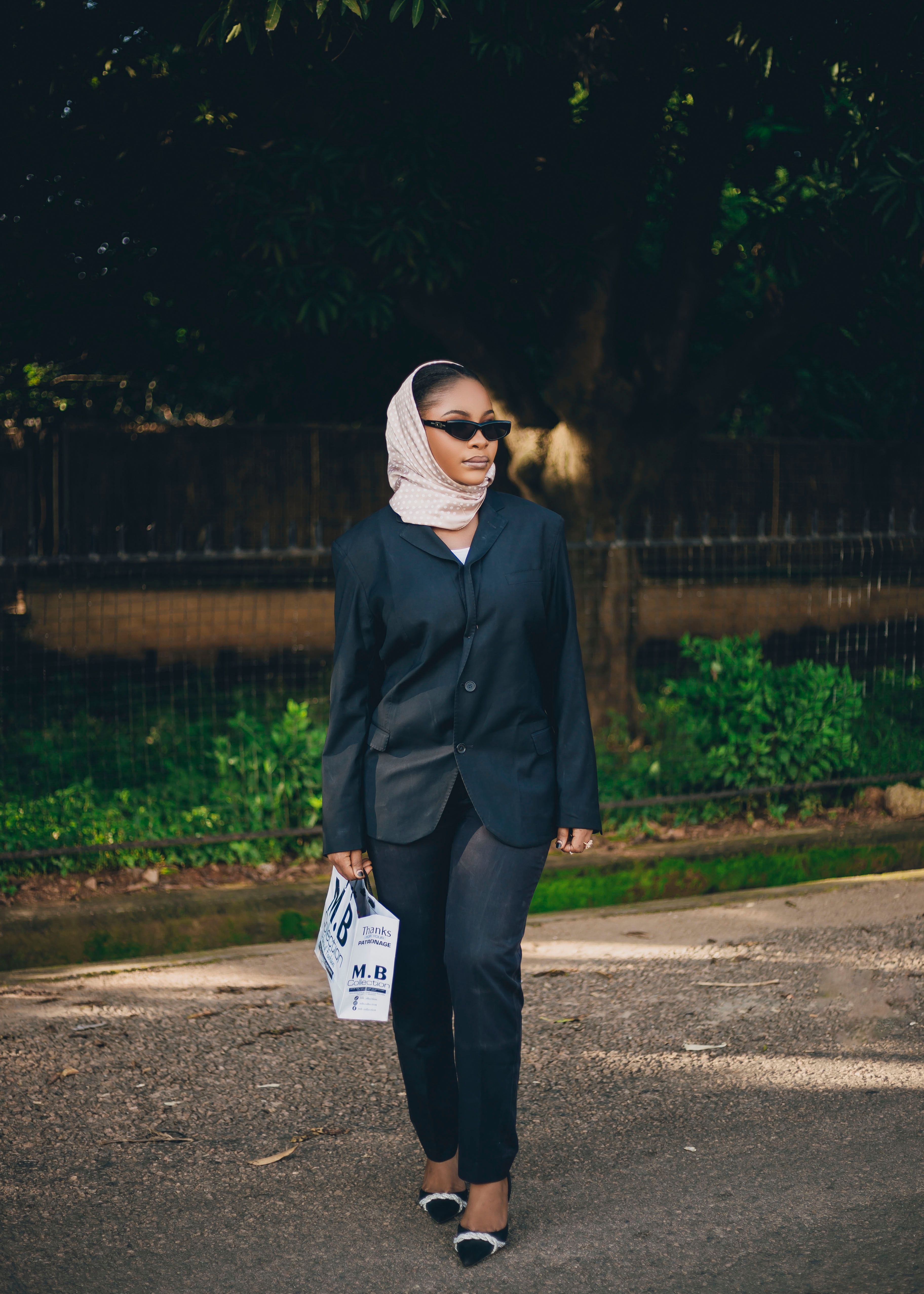 Stylish Woman in Hijab Walking Outdoors · Free Stock Photo