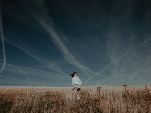 Free Woman on Brown Field Stock Photo