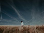 Woman on Brown Field