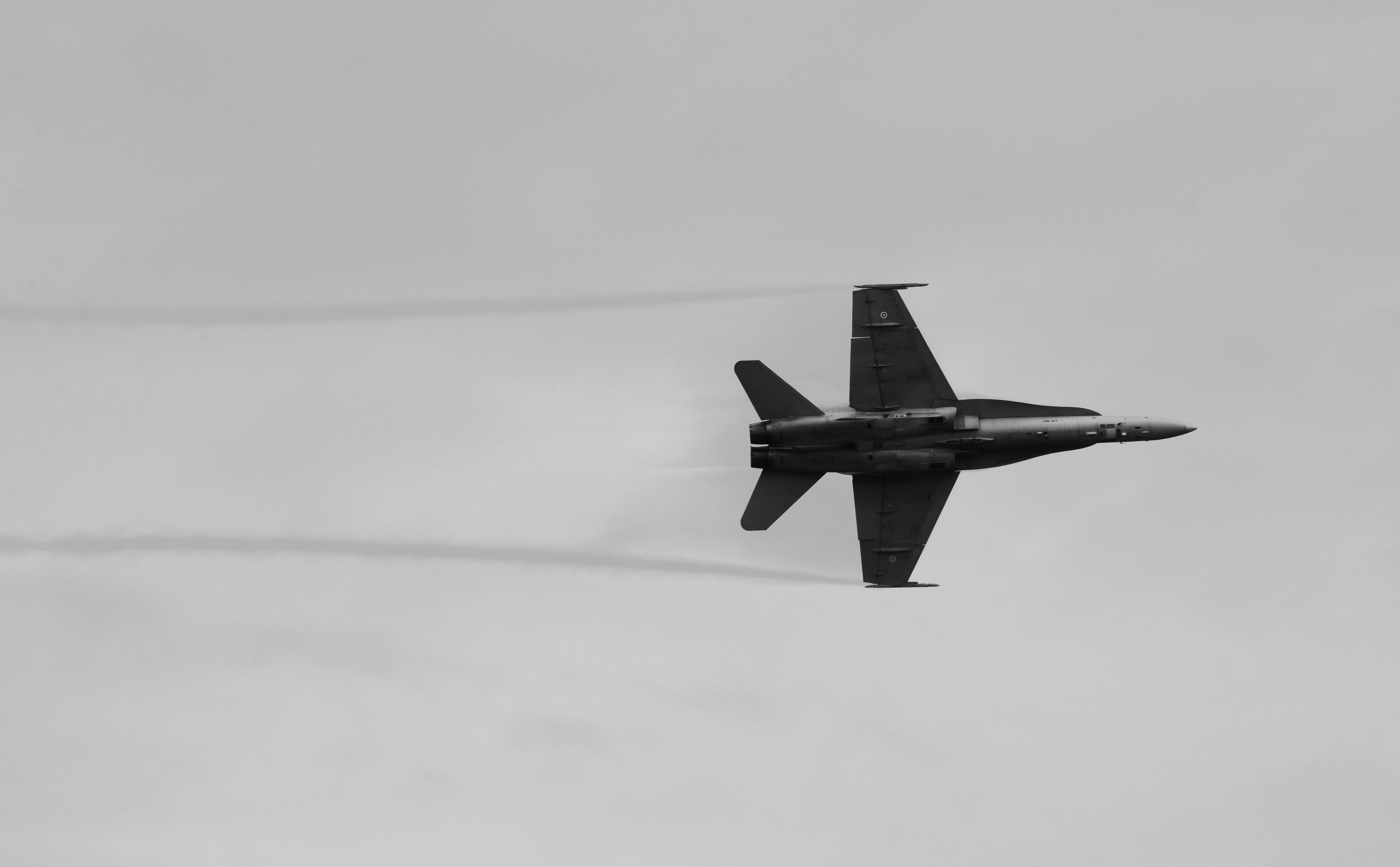 Black and White Fighter Jet in Flight Over England · Free Stock Photo