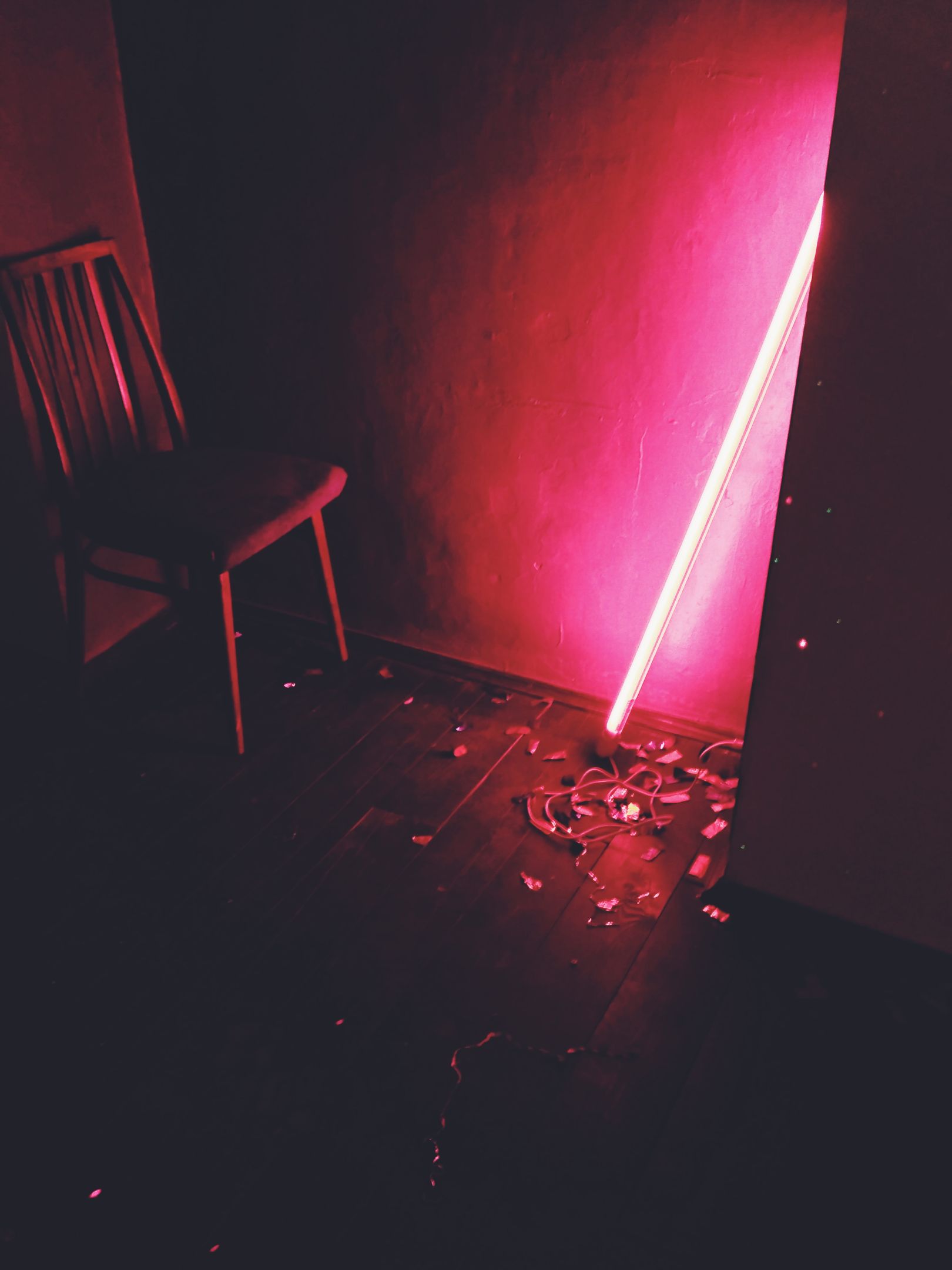 Dark room lit with red neon glow