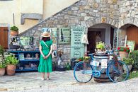 Tourist admires local crafts in Hum, Croatia. Perfect travel and lifestyle shot.