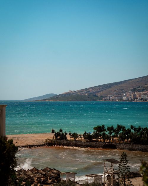 Free Breathtaking view of Sarandë's turquoise waters and coastline in Albania. Stock Photo