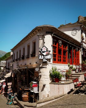 A scenic street view of Gjirokastër's historic architecture and bazaar.
