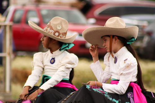 Free Two young horsewomen in traditional Mexican attire in San Juan Tizahuapan, showcasing cultural heritage. Stock Photo