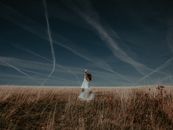Woman in White Dress Standing on Plant Field