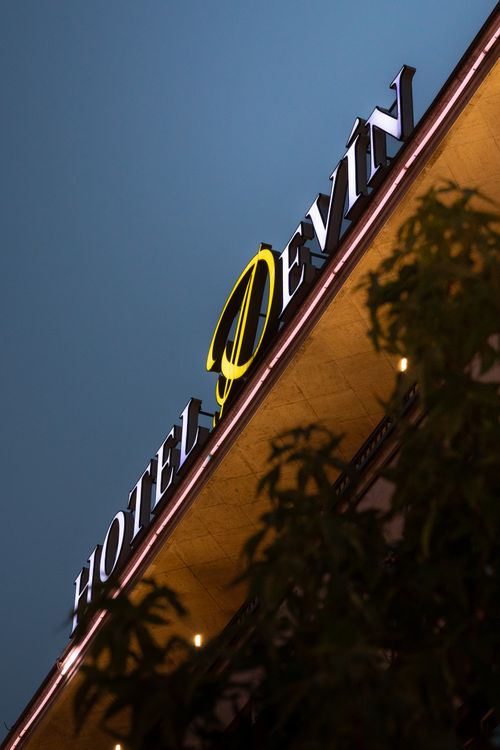 Free Close-up of Hotel Devín's illuminated sign at twilight, Bratislava. Stock Photo