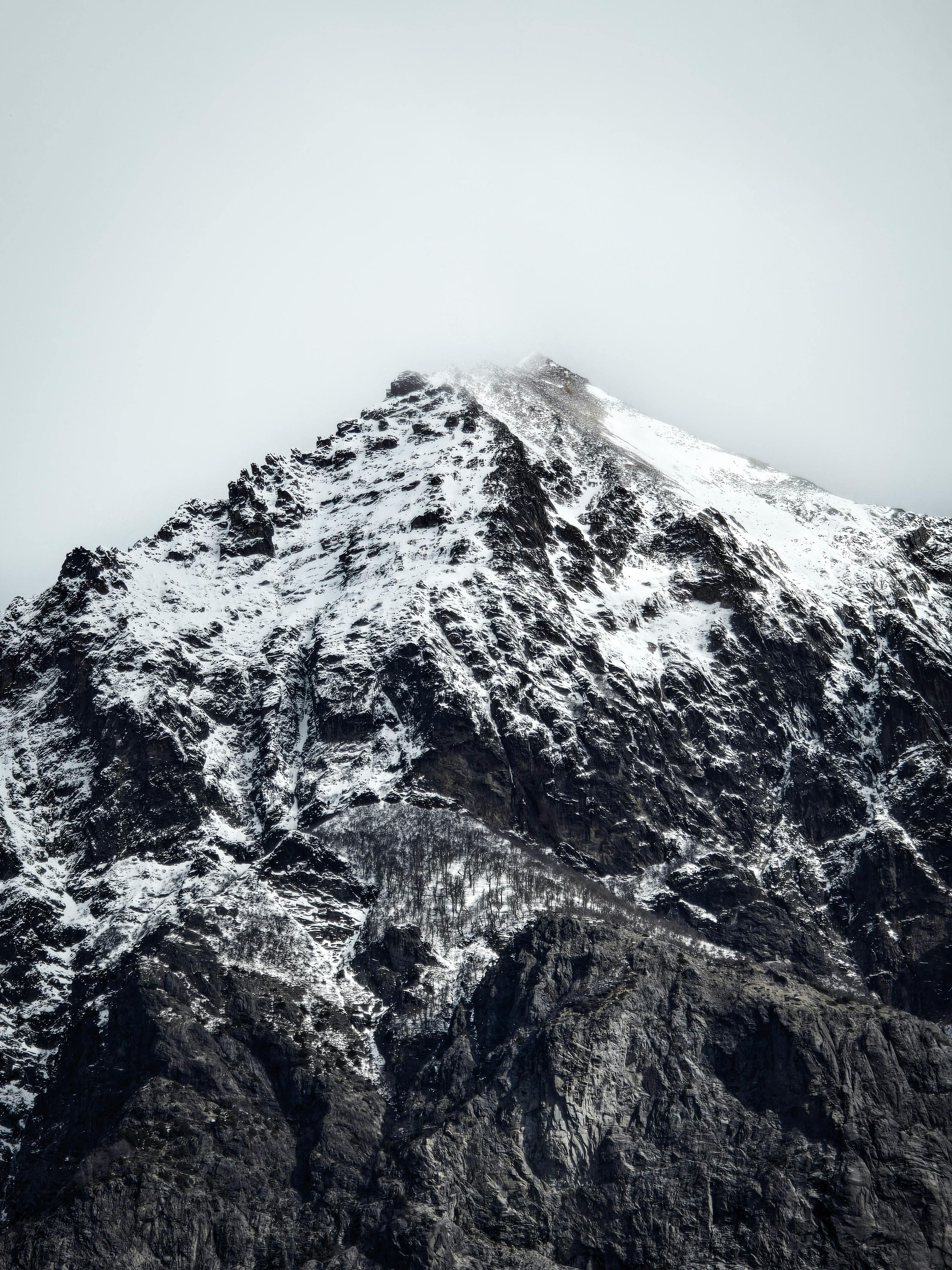 Stunning view of a snow-covered peak in Bariloche, Argentina, capturing natural beauty and rugged terrain.
