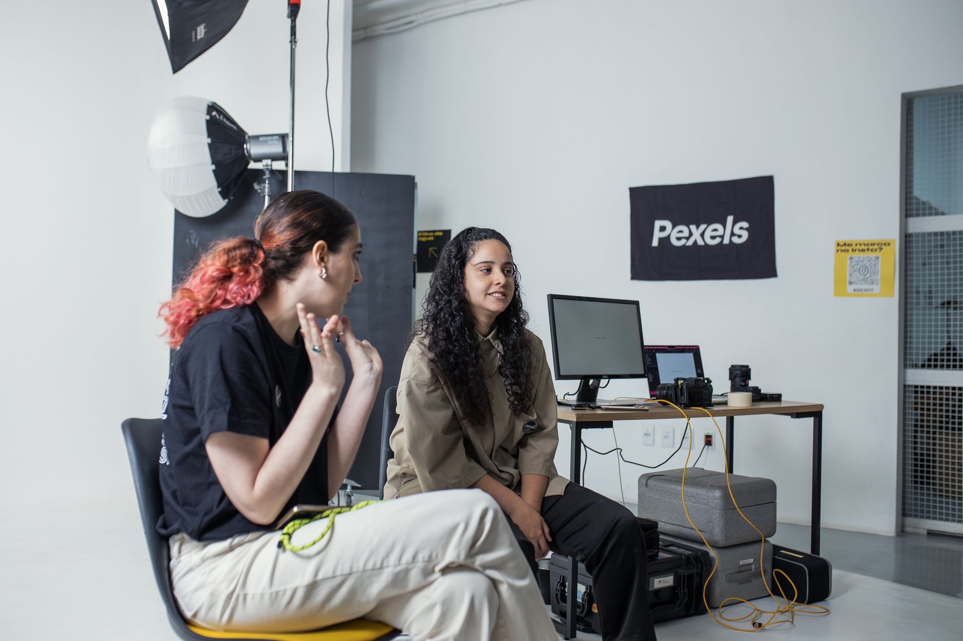 Photographer signing a contract with a client for a session