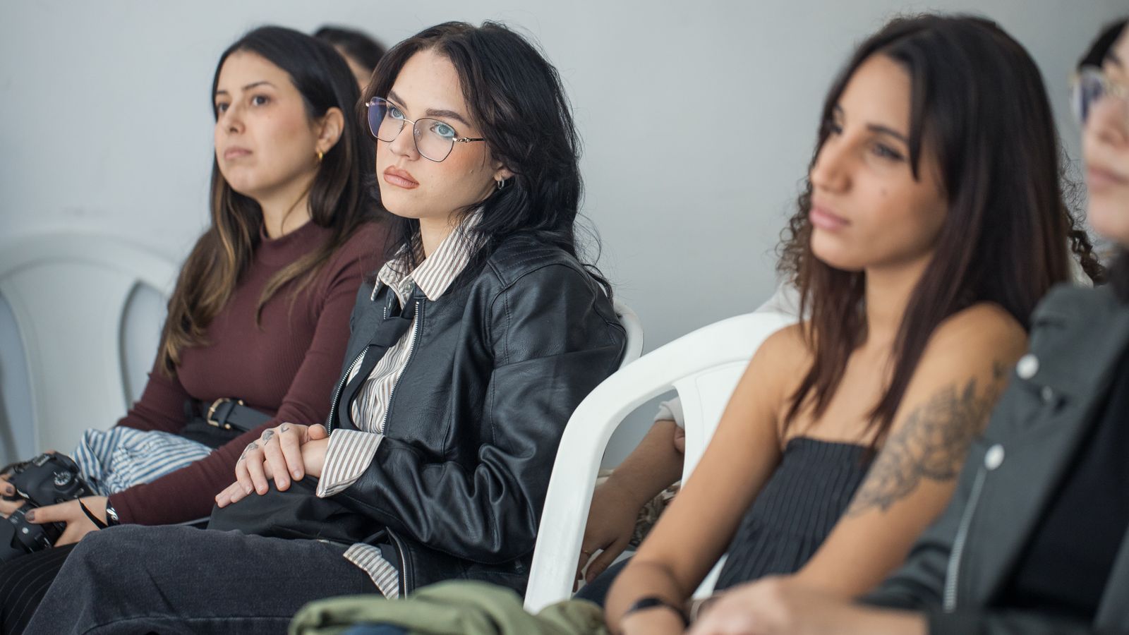 A small group of people standing together, representing a targeted audience