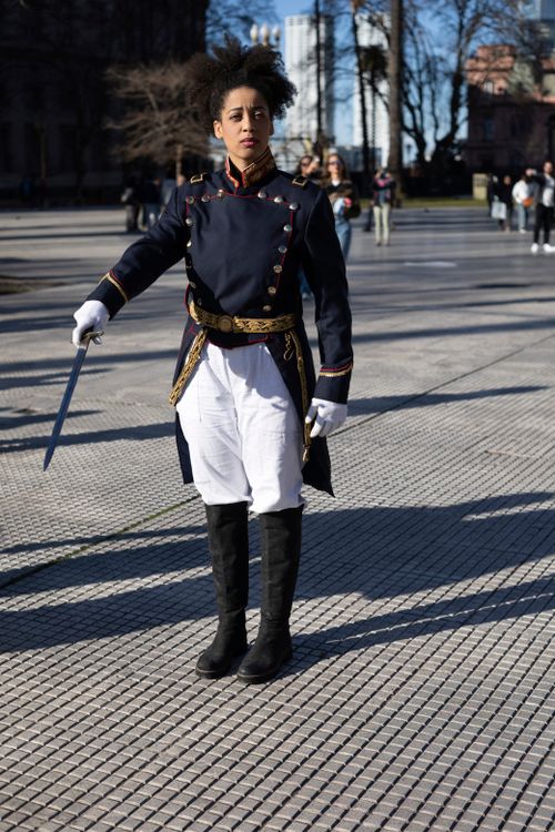 Free Woman in historic military uniform on city street in Buenos Aires, Argentina. Stock Photo
