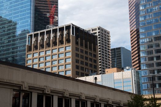 Modern skyscrapers with a construction crane in downtown Calgary, Alberta, Canada.