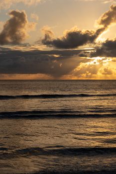 Breathtaking view of a sunset with clouds over the ocean in Fiji, capturing nature's serenity.