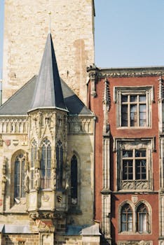 Architectural details of Gothic spires and Renaissance facades in Prague.