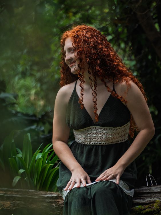 Portrait of Woman in Green Dress in Lush Forest · Free Stock Photo