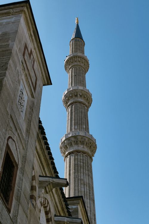 Free Stunning view of an Ottoman minaret with intricate design, set against a clear blue sky. Stock Photo