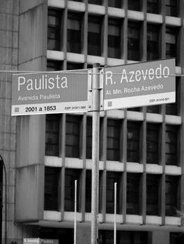 Black and white photo of street signs at Avenida Paulista, São Paulo