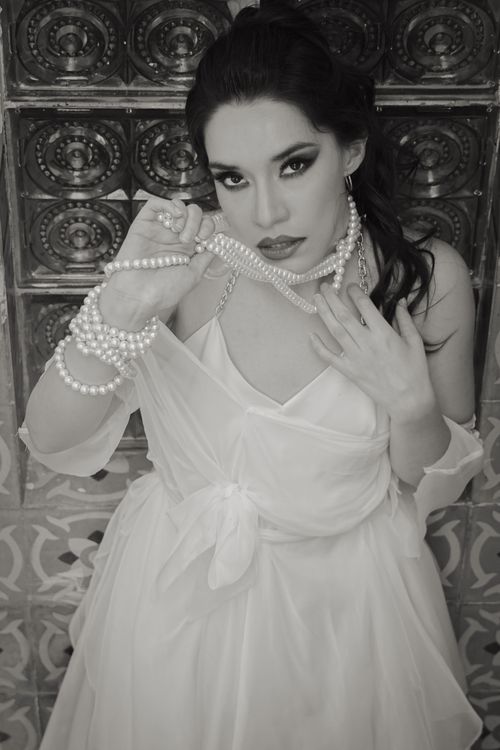 Elegant Woman in Pearl Necklace and Gown · Free Stock Photo