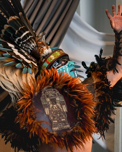 Free Vibrant Aztec dance performance featuring ceremonial feathers and intricate face paint. Stock Photo