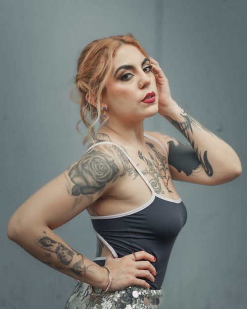 Free Artistic portrait of a glamorous woman with tattoos and fashion style. Stock Photo