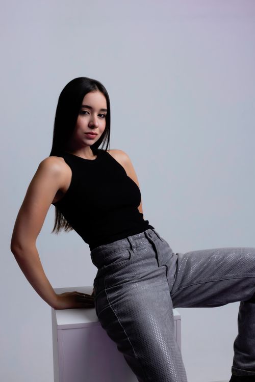 Free Portrait of a woman in modern fashion, exuding confidence and elegance. Stock Photo