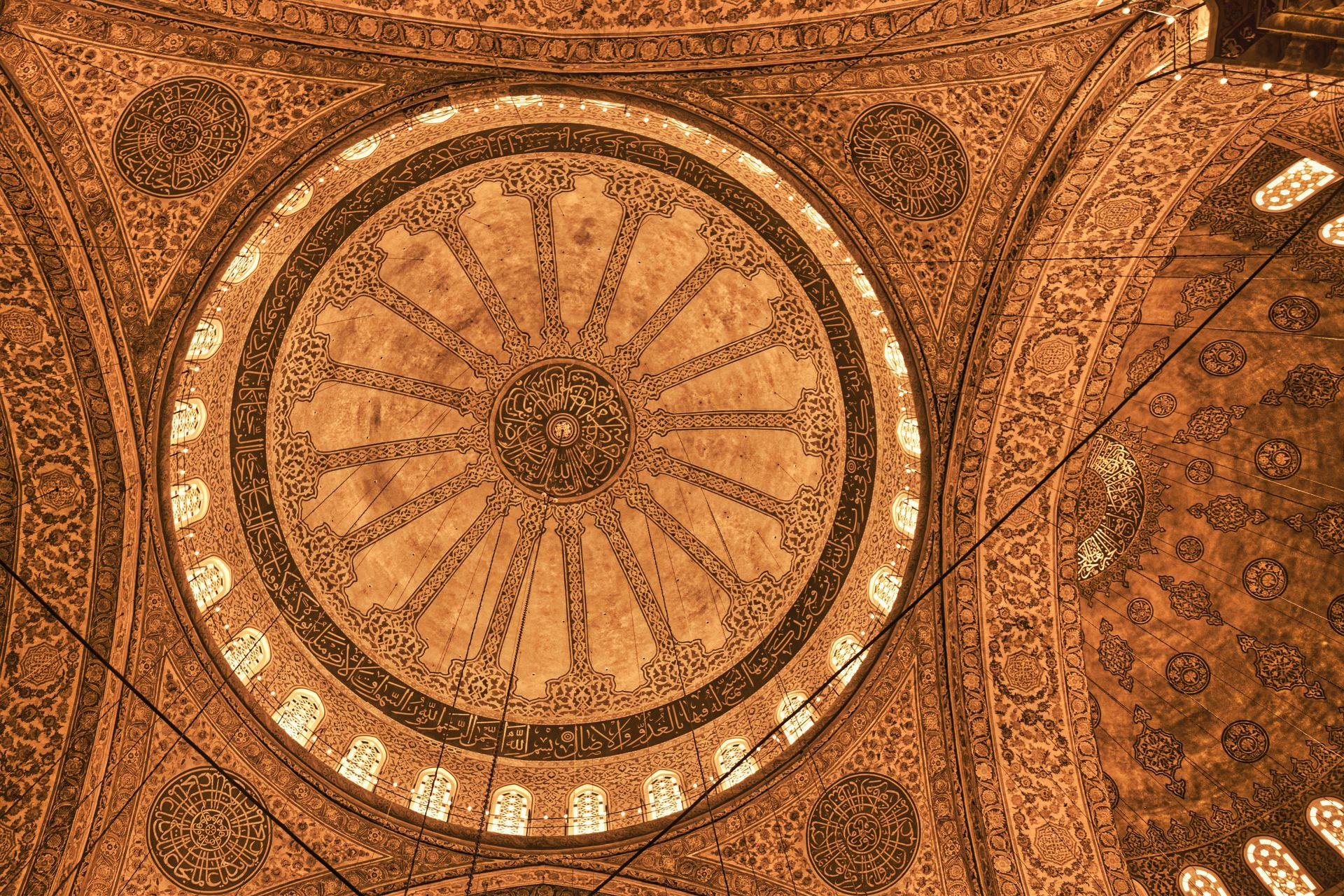 Explore the exquisite Islamic architectural details of a mosque ceiling in Türkiye, showcasing intricate patterns and designs.