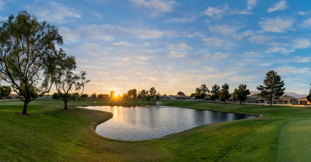 Beautiful sunset over a tranquil golf course pond in Banning, California. Perfect for landscape and nature enthusiasts.