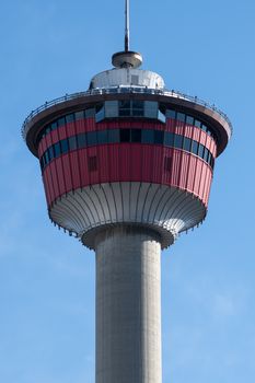 Detailed view of the Calgary Tower with blue sky background.