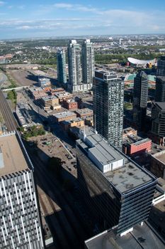 Aerial perspective of a modern city with skyscrapers and urban architecture in daylight.