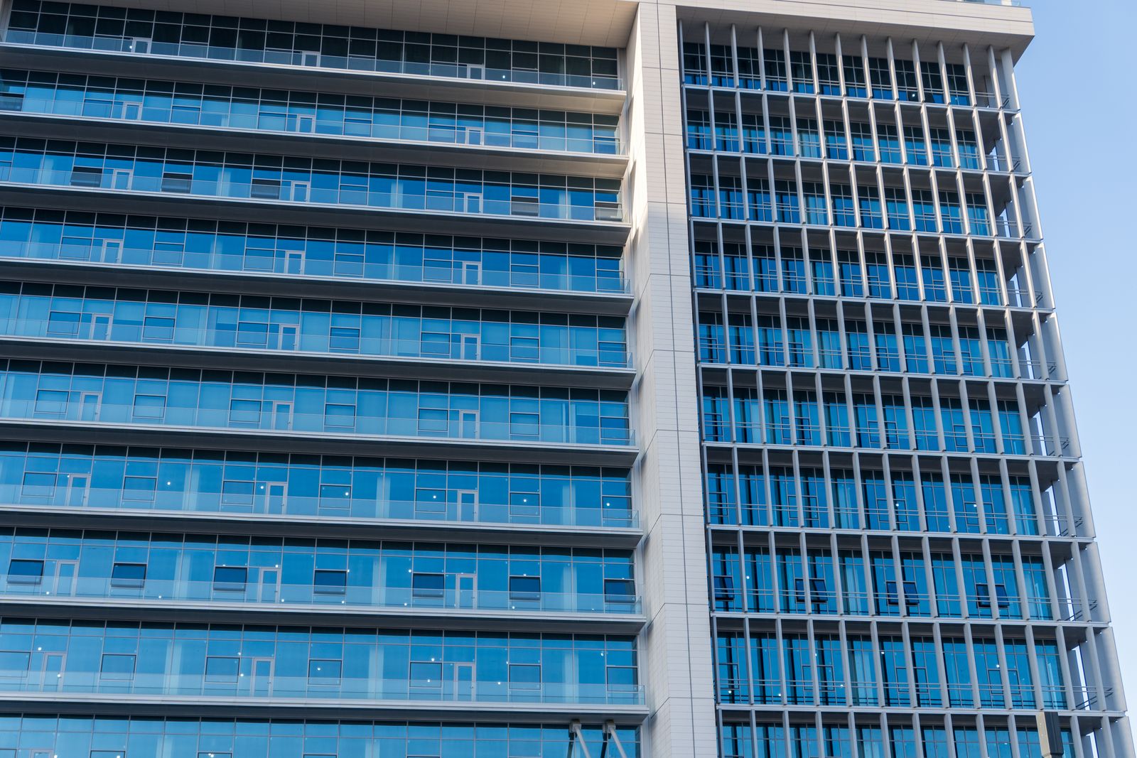 Modern glass office building representing a process-driven organisation
