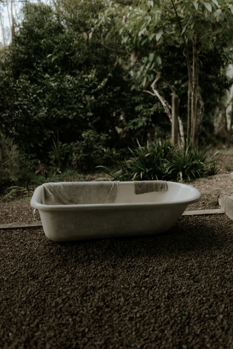 Outdoor bathtub in a garden setting — a simple DIY cold plunge option