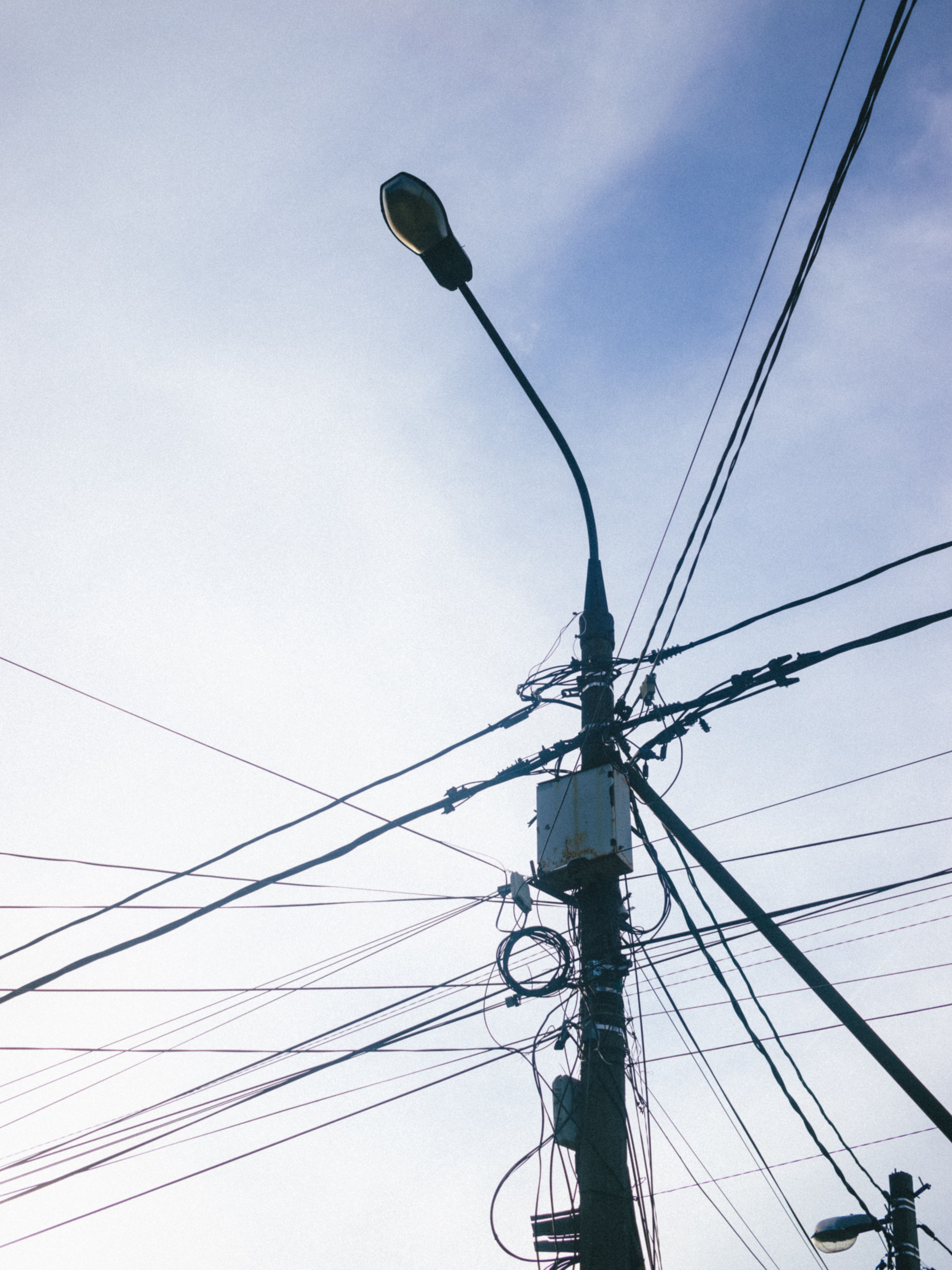 Urban Power Lines and Street Lamp Against Blue Sky · Free Stock Photo
