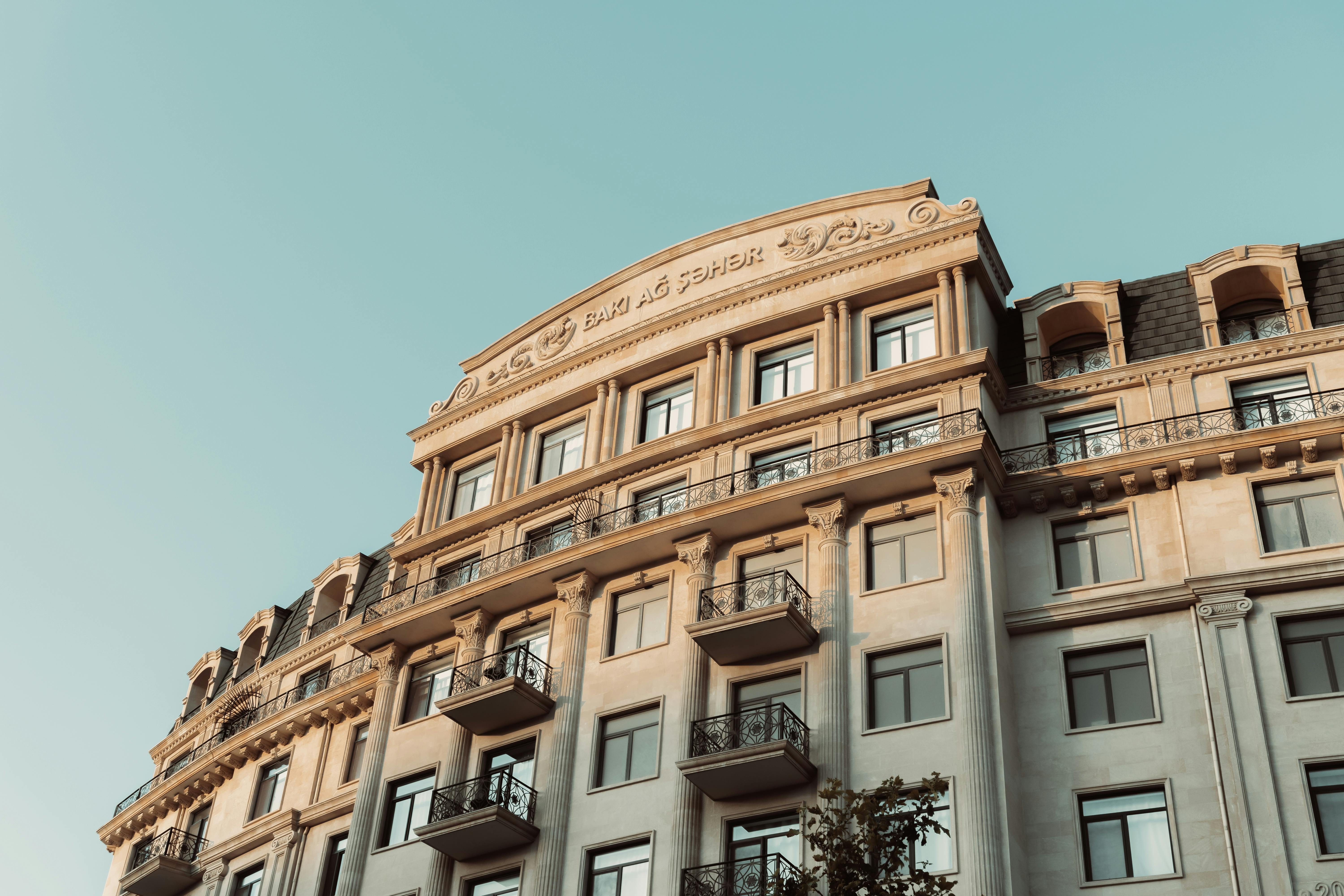 Ornate building facade in Baku, featuring classic design under a clear sky.