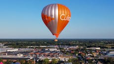 Orange Hot Air Balloon Over Dutch Countryside