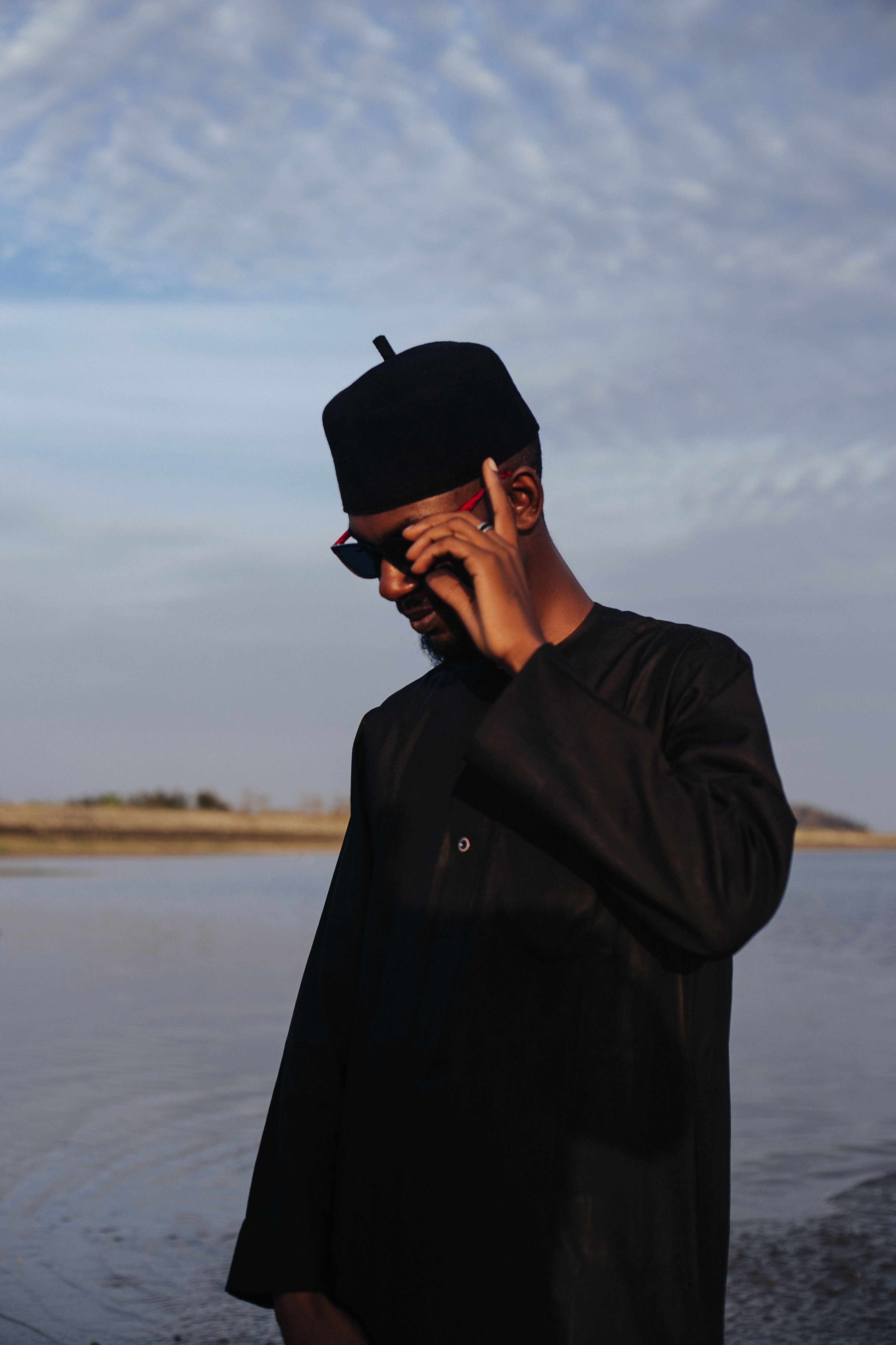 Man in Traditional Clothing by the Water