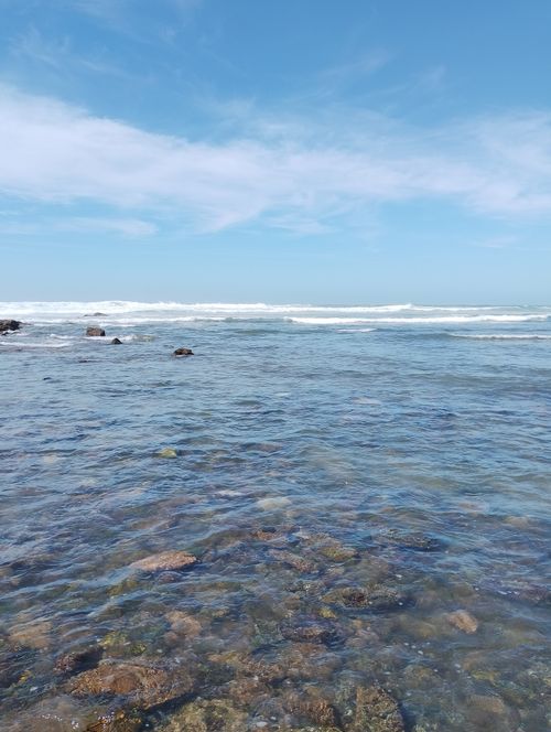 Free Clear blue waters and rocky shoreline of Casablanca under a bright sky. Stock Photo