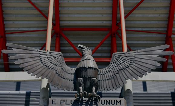 Stunning eagle statue with spread wings at Estรกdio da Luz in Lisbon, Portugal.