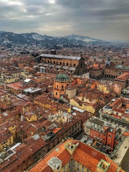 Stunning aerial view of Bologna featuring historic architecture and terracotta rooftops.