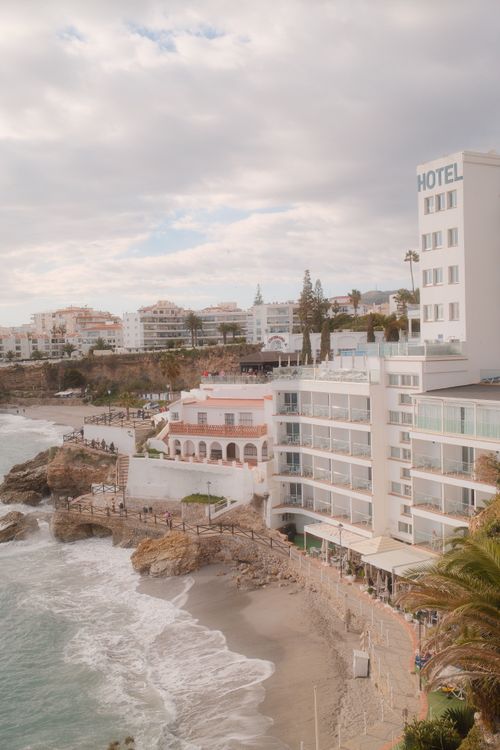 Free A scenic view of a seaside hotel and beach in Nerja, Spain. Stock Photo