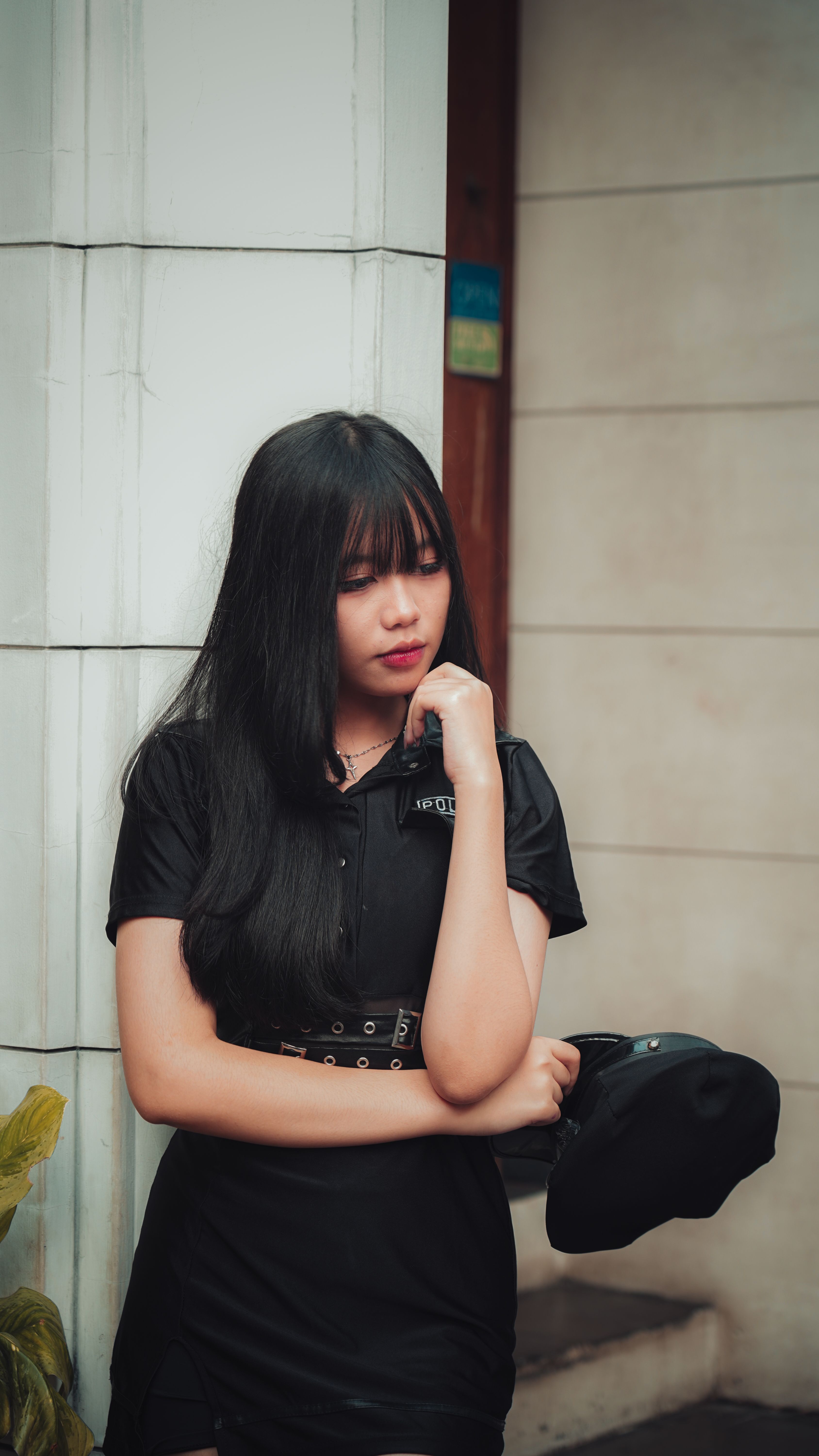 Pensive Young Woman in Urban Setting